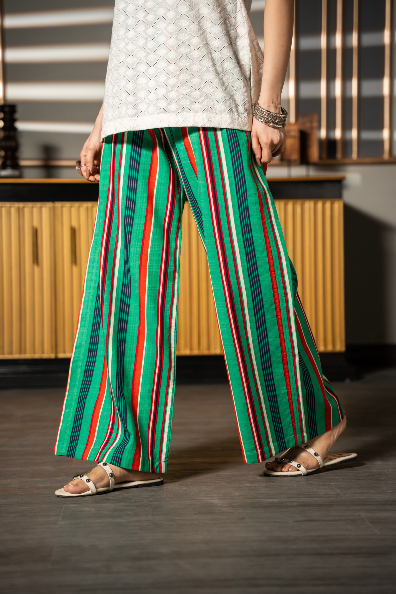 Daydream Set by Posheri, close-up of green and red striped wide-leg pants with white embroidered top