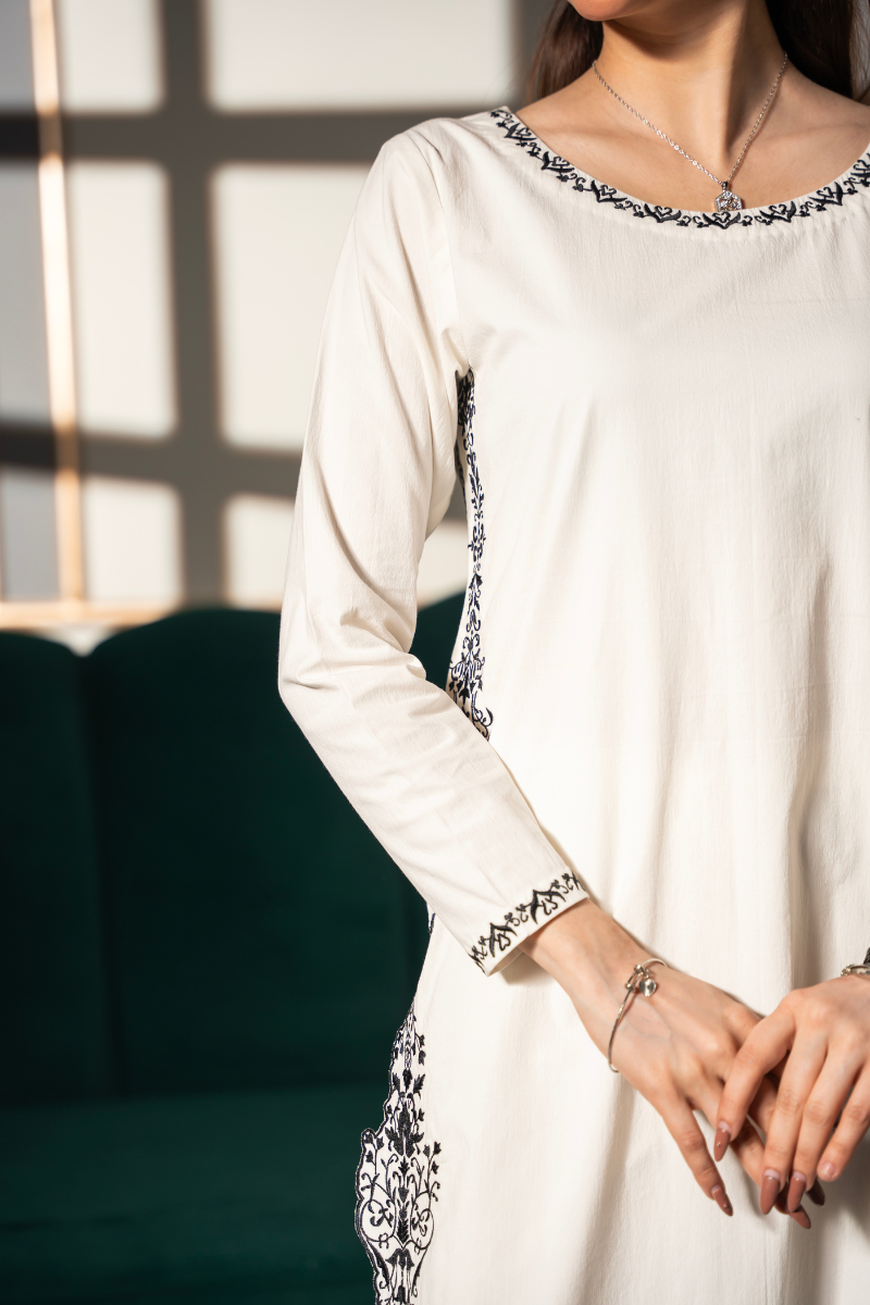 Noor Silhouette embroidered ivory cotton twill kurta and pant set by Posheri