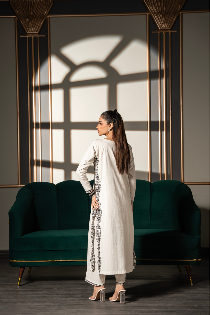 Noor Silhouette embroidered ivory cotton twill kurta and pant set by Posheri