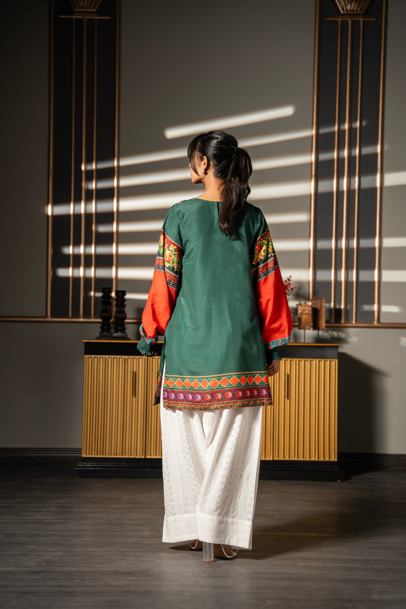 Back view of Floral Folklore emerald green printed kurta with orange floral sleeves and contrasting hem border by Posheri