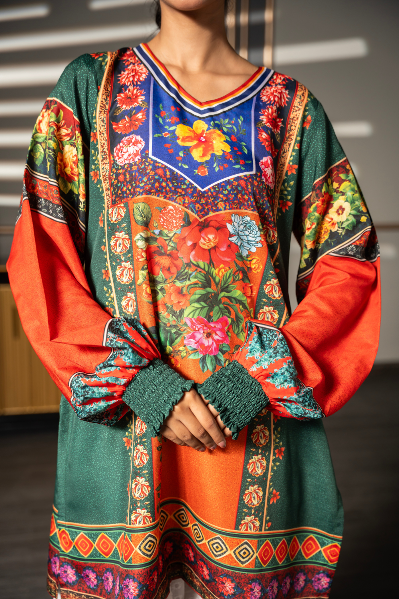 Close-up of Floral Folklore emerald green kurta showing floral placement print, orange balloon sleeves and smocked cuffs by Posheri