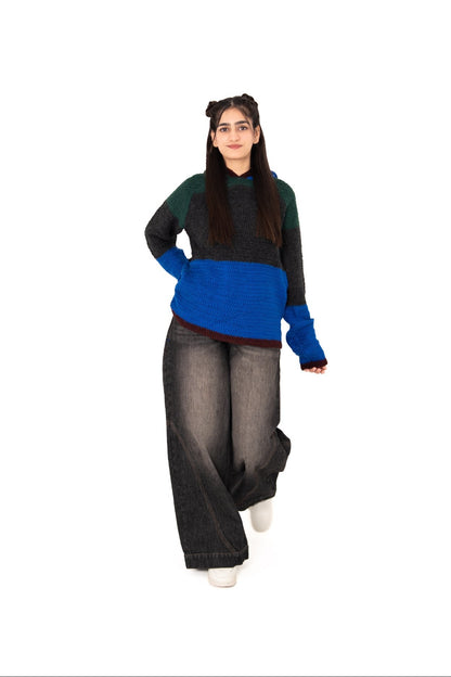 Dark Mode colour-block crochet hoodie, model walking in wide-leg washed black jeans