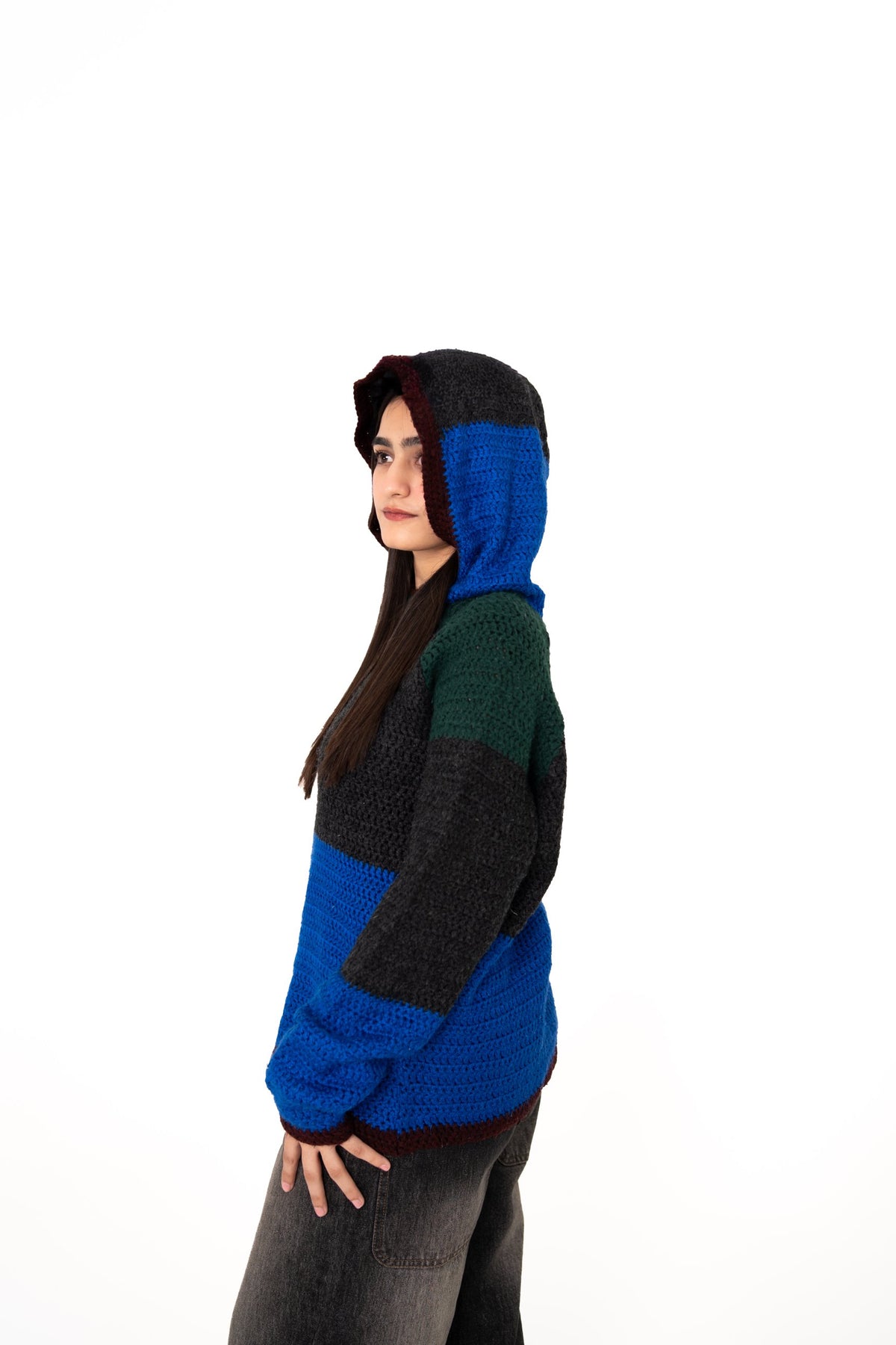 Dark Mode crochet hoodie side view with hood up, blue and charcoal hood with maroon trim
