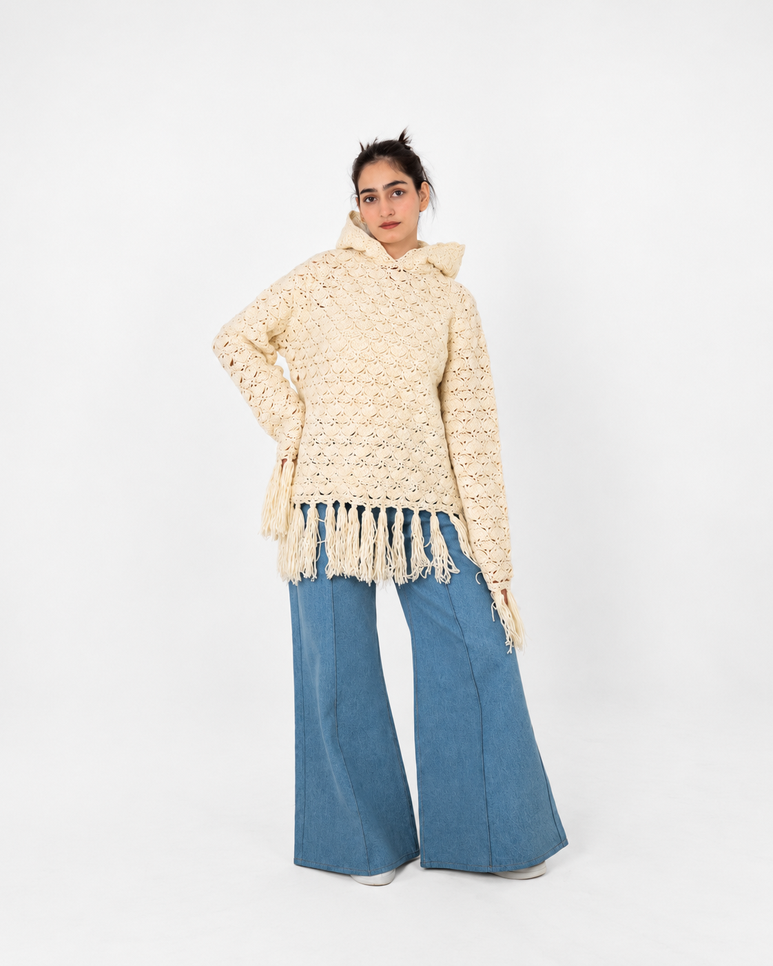 Fringe Benefits ivory handmade crochet hoodie by Posheri, front view with fringed hem and cuffs, styled with wide-leg denim