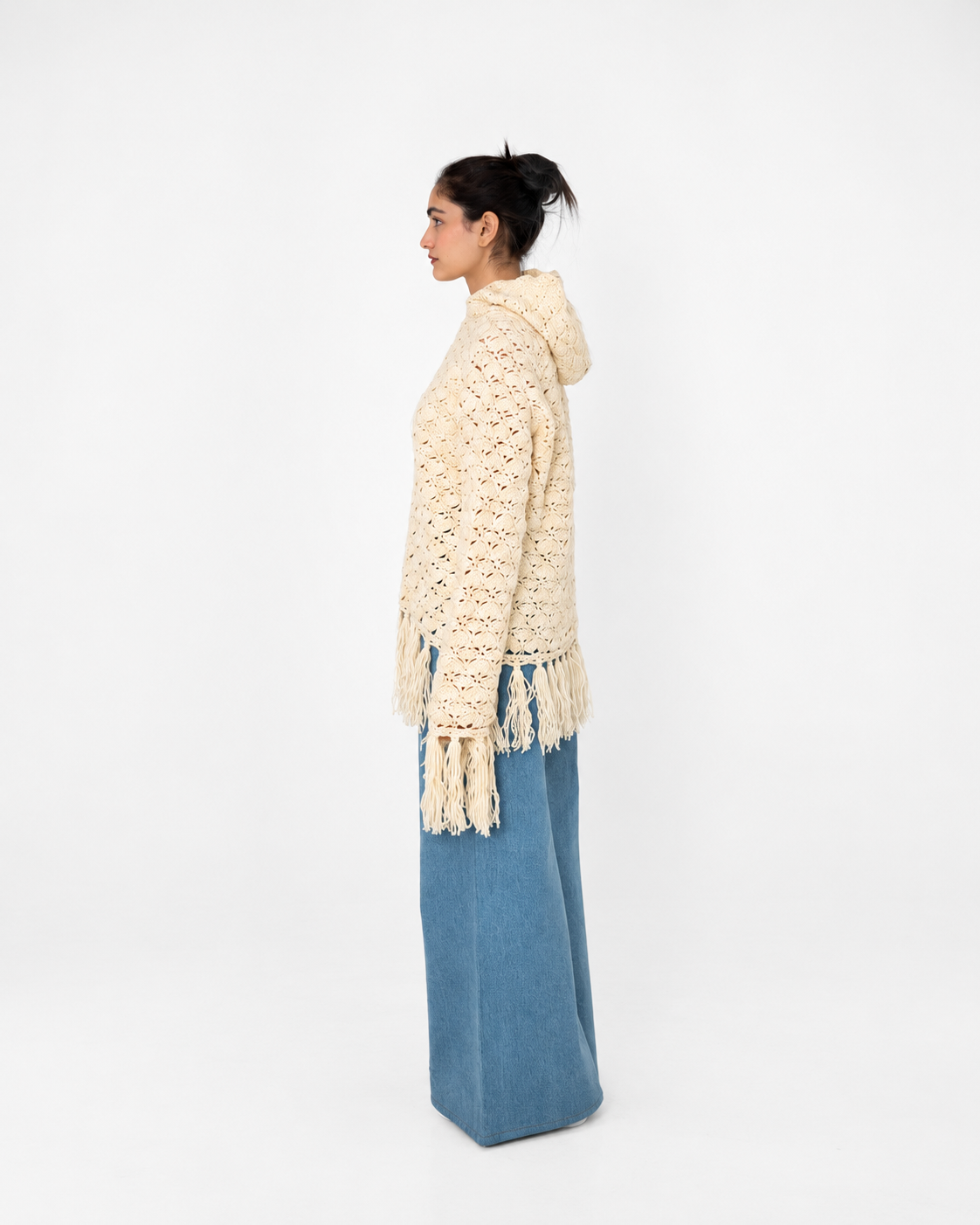 Fringe Benefits ivory crochet hoodie, side view showing the relaxed fit and fringed sleeves