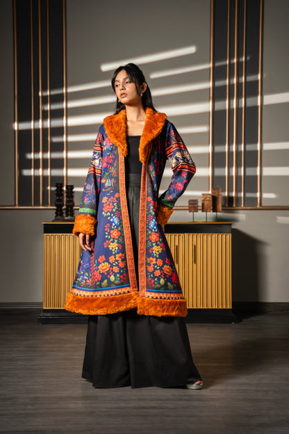 Jeans Poshak longline floral-print coat worn open over black separates, full-length front view