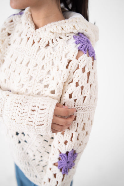 Lilac Cameo crochet hoodie sleeve close-up with ivory openwork stitch and lavender flower