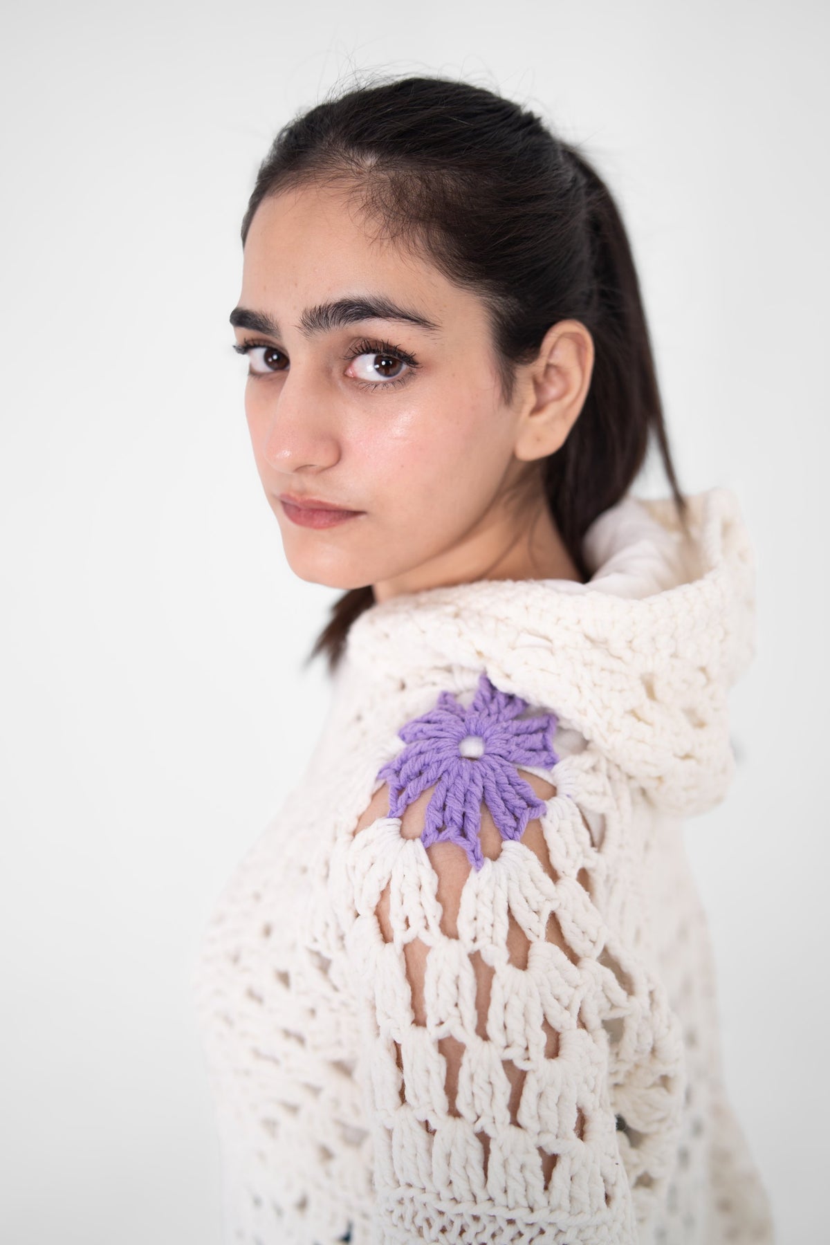 Lilac Cameo crochet hoodie shoulder detail with lavender crochet flower