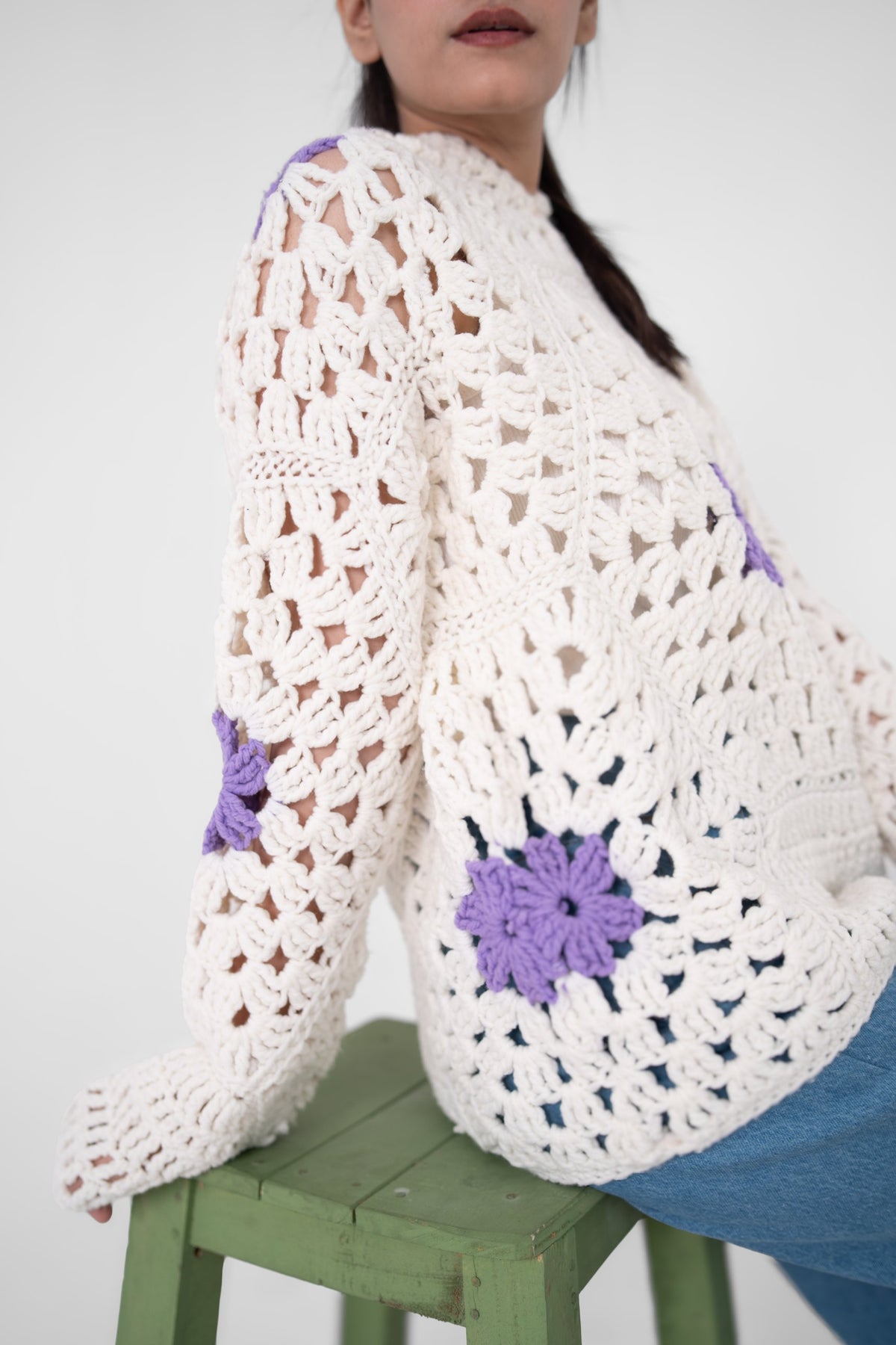 Lilac Cameo ivory crochet hoodie side view showing lavender florals on sleeve and body