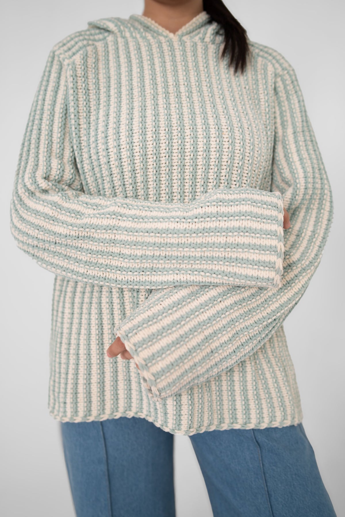 Mint Condition crochet hoodie front close-up showing pale mint and ivory vertical ribbed stripes