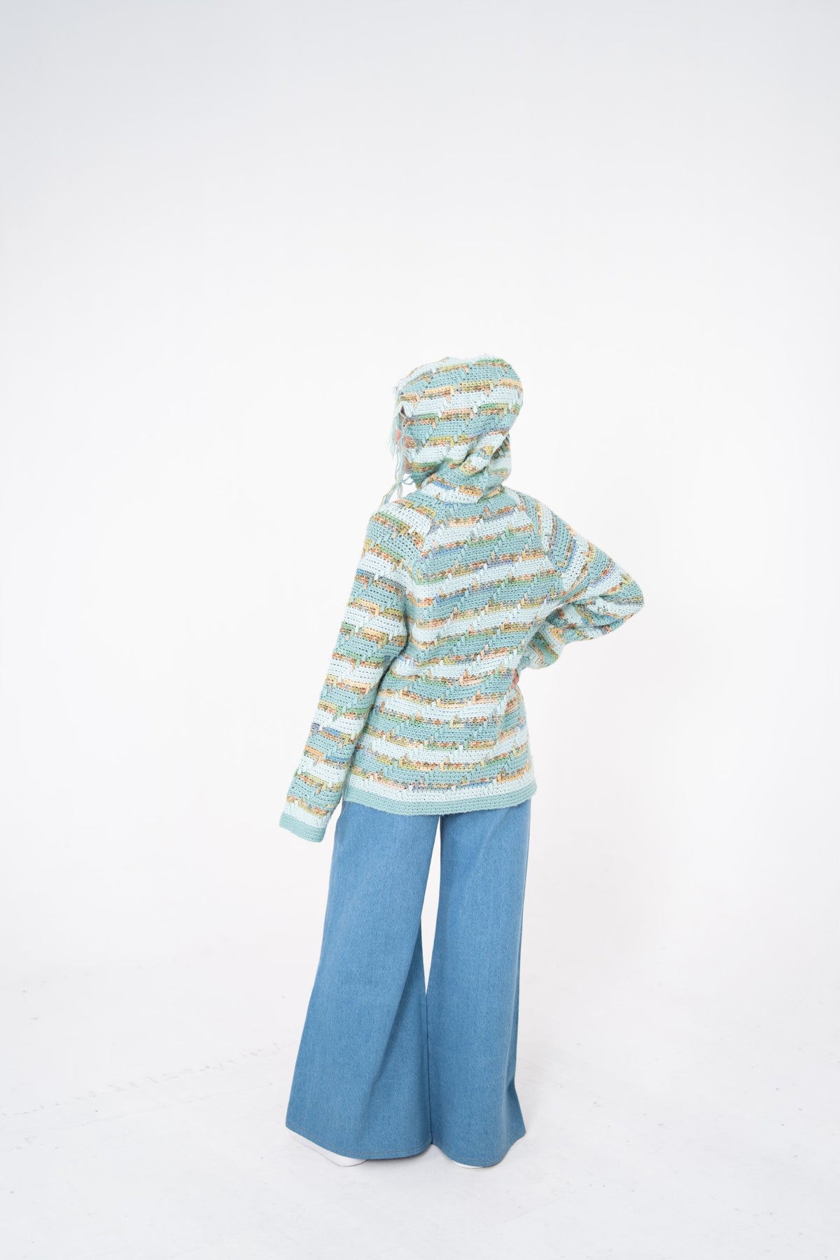 Pastel Static mint and cream crochet hoodie back view with hood up