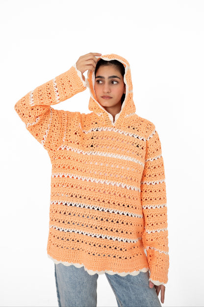 Model wearing Peach Please peach and ivory openwork crochet hoodie with hood up – POSHERI