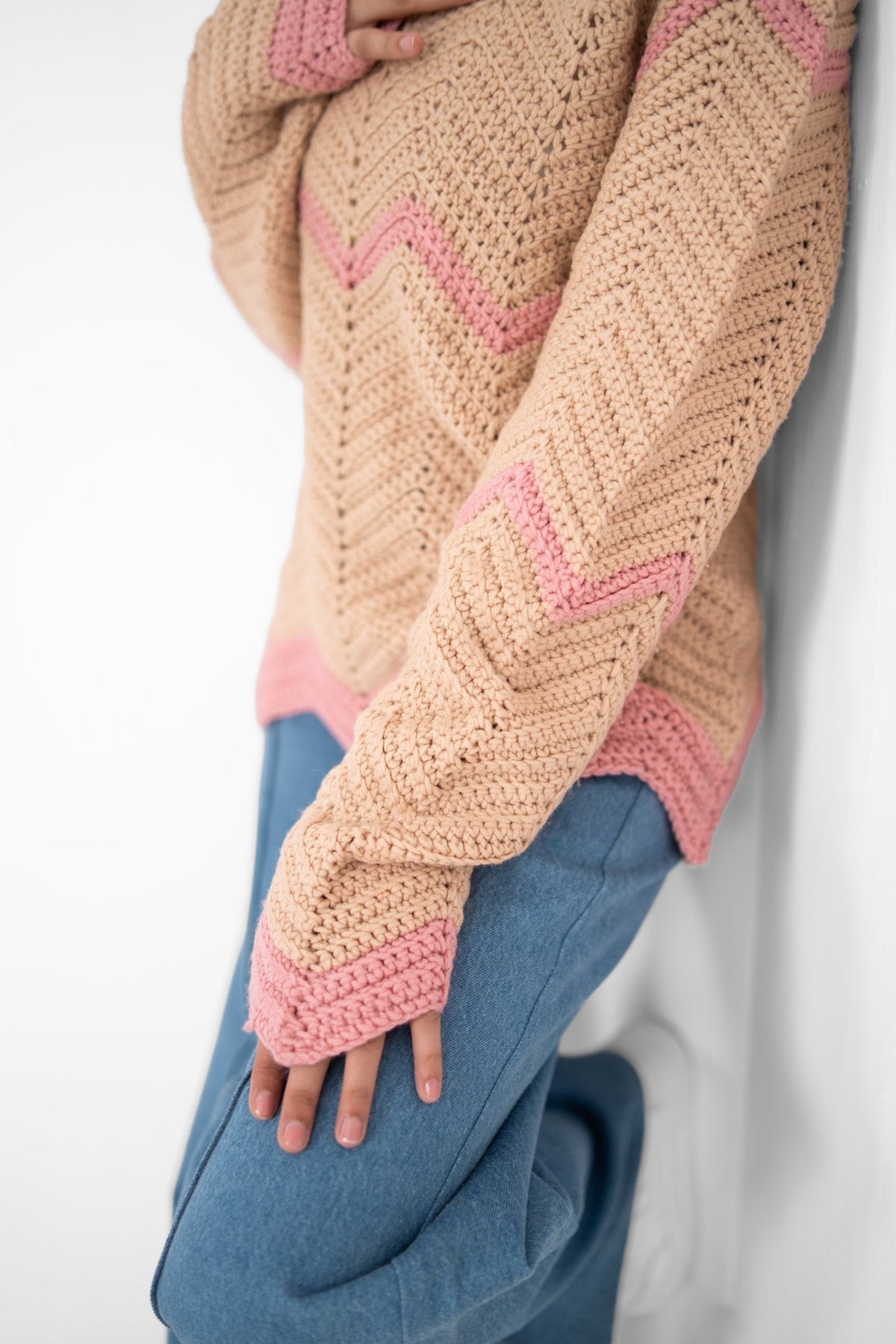 Close-up of Pink Plot Twist crochet stitches with pink chevron stripe and contrast pink cuff – POSHERI